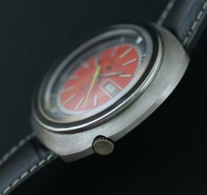 Seiko 5 orange dial sports watch crown